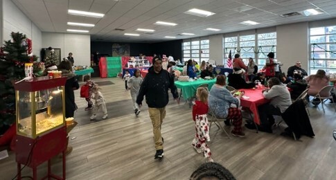 Tables of Housing Authority residents having a hot, homemade holiday meal.